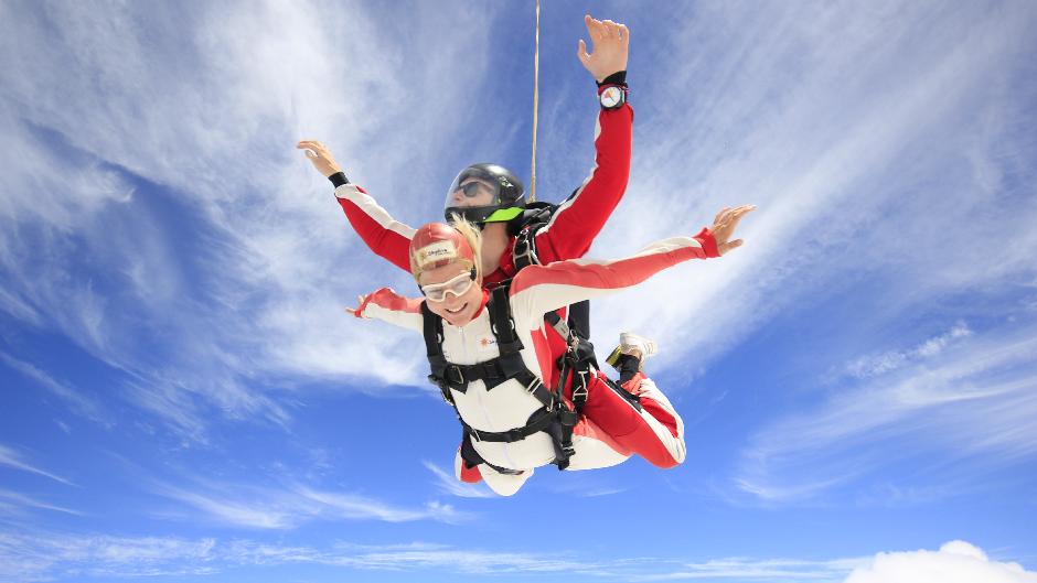 Enjoy a panoramic flight with stunning views as you climb to 13,000ft over snow-capped mountains, golden beaches and turquoise oceans then... JUMP!